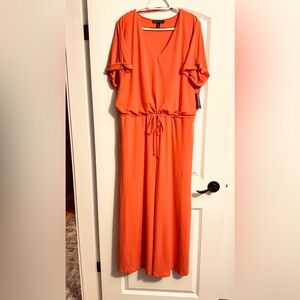 Bright and romantic Coral colored, floor length , V-necked, batwing sleeves .